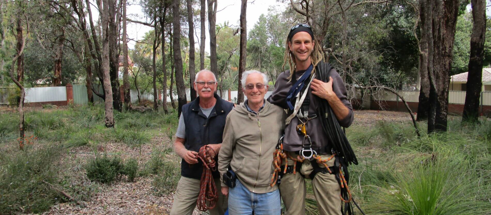 Three male Friends of Vernallen Reserve members with climbing equipment