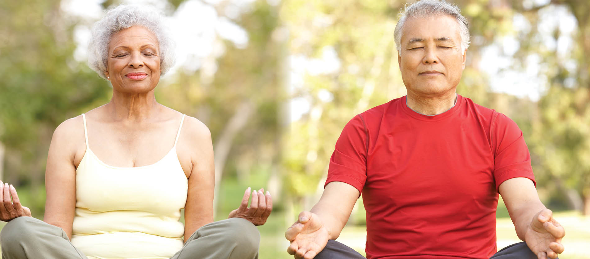 Couple doing yoga session outside